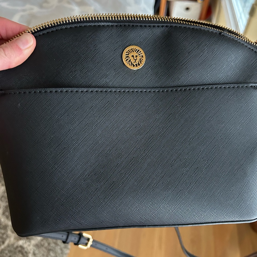 Black Designer Handbag with Gold Accents